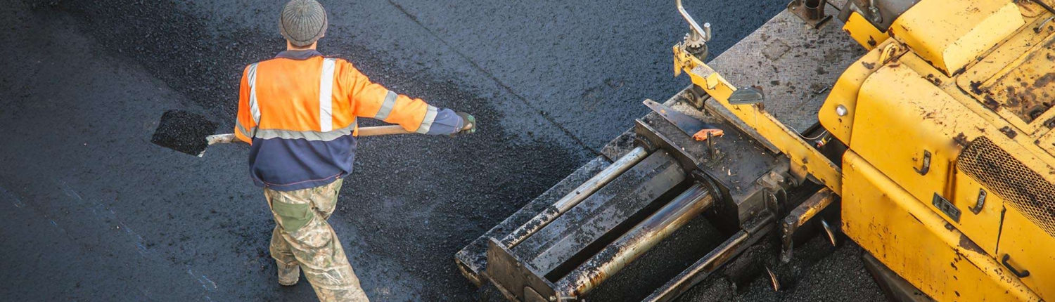 Workers Repaving Asphalt Road