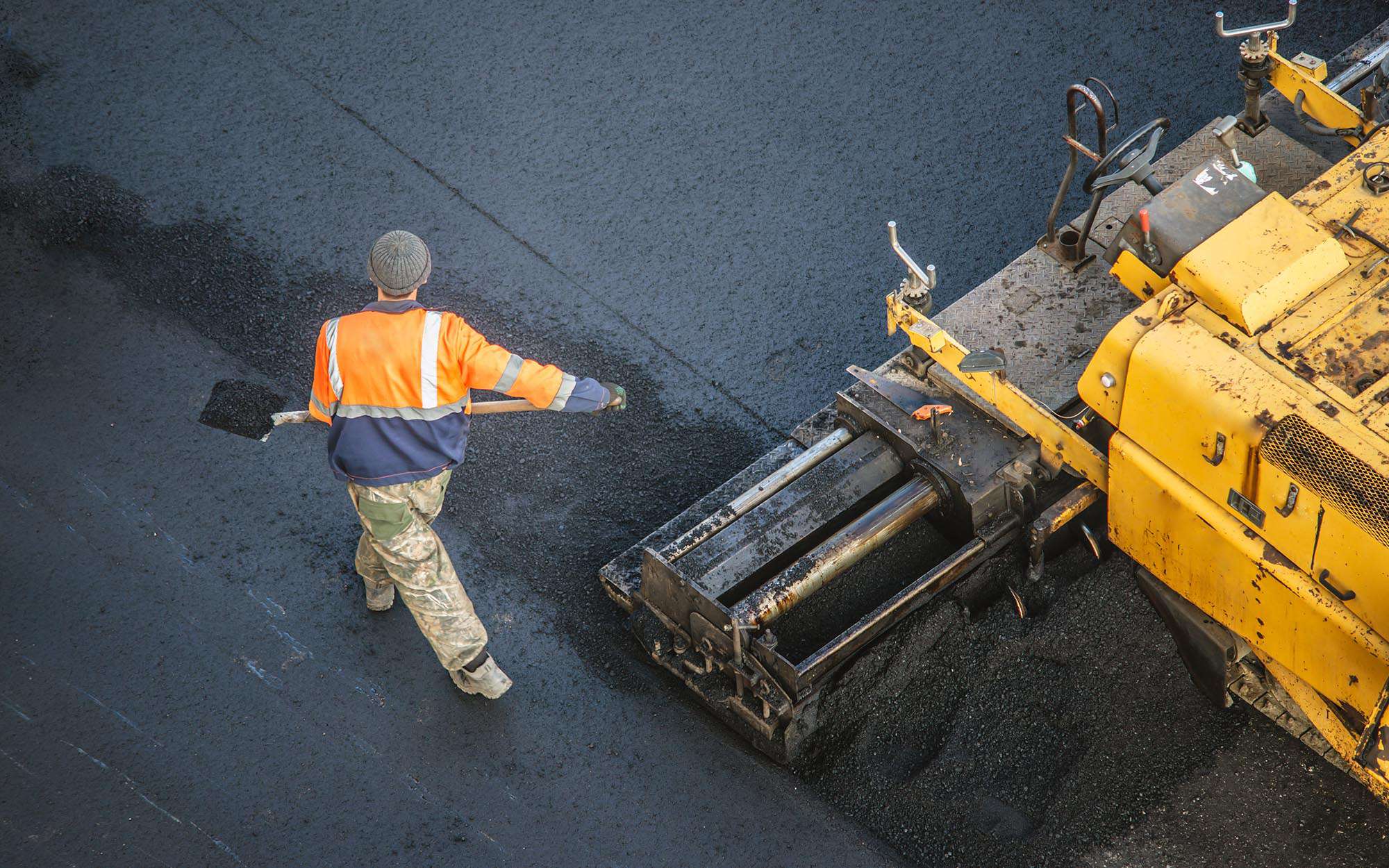 Workers Repaving Asphalt Road