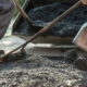 Workers making new asphalt pavement