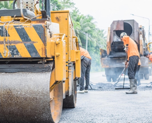 Workers Resurfacing Asphalt Road