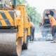 Workers Resurfacing Asphalt Road