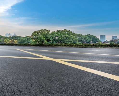 Empty Asphalt Road And City Skyline And Building Landscape